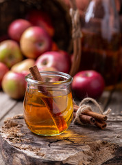 Wall Mural - Glass of Apple Cider With Cinnamon Sticks