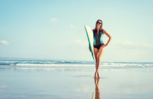 Hobby And Vacation. Holiday On The Beach. Pretty Young Woman Carrying Surf Board.