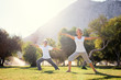 © luengo_ua - Yoga at park. Senior family couple exercising outdoors. Concept of healthy lifestyle.