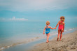 © nadezhda1906 - cute little girls go swim on beach vacation
