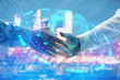 © Andrey - Double exposure of world map on cityscape background with two businessmen handshake. Concept of international business