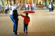 © Arkady Chubykin - Mother and son visiting Church