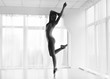 © Prostock-studio - Lady Dancing Classic And Modern Ballet Next To Curtained Window