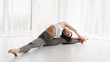 © Prostock-studio - Contemp Artist Stretching For Splits In Dance Class