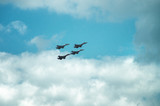 Fototapeta Na sufit - Group of four military aircraft of fighters, jet airplane in the sky make maneuvers
