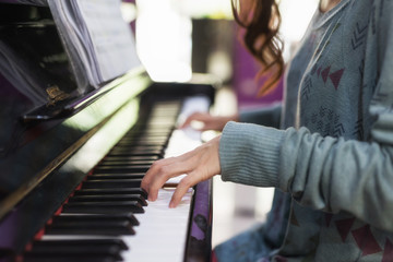 Closeup hand playing on classic Piano