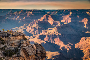Wall Mural - hikers in grand canyon national park at sunset, arizona, usa