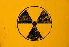 Black Radioactive Sign Over Yellow Background