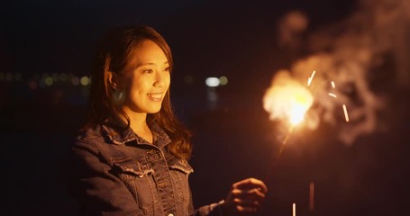 Canvas Print - Woman play sparkler at night