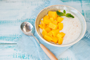 Oatmeal bowl with mango for Breakfast