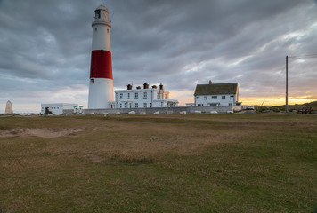 Portland Bill Lighthouse / An image of Portland Bill lighthouse as the sun begins to set, shot at Portland Bill, Dorset, England, UK.