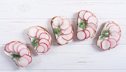 Wall Mural - Healthy vegetable toasts sandwith with radish and dill