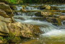 Waterfall Downstream On Rocks