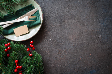 Christmas festive table setting with empty tag in rustic stile.