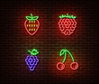 Neon vegetables berrys signs vector isolated on brick wall. Strawberry, raspberry, cherry, grape lig