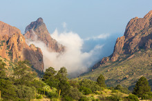 Clouds Passing Over 'The Window' In The Chisos Basin During The Day In Big Bend National Park (Texas).