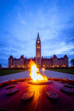 Canada Parliament Building And Centennial Flame Fountain In Ottawa During Blue Hour