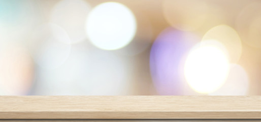 Wooden table, tabletop, desk over blur store with bokeh light background, Empty wooden shelf, counter, desk for retail shop product display background, Wood table top surface for food backdrop, mockup