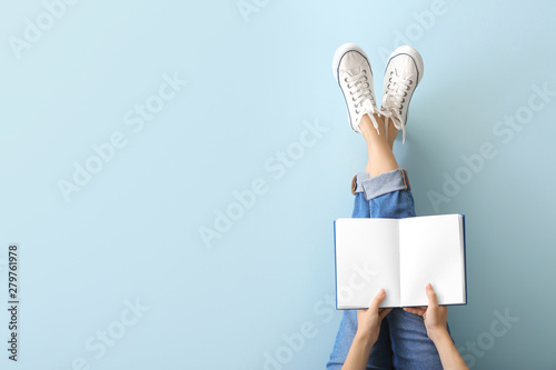 Fotografía Woman with book on color background