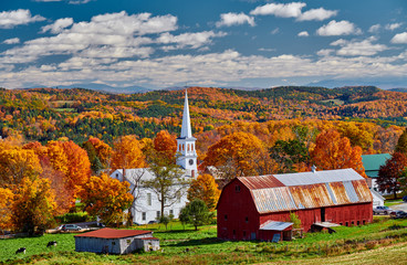 Wall Mural - Congregational Church and farm with red barn at sunny autumn day in Peacham, Vermont, USA