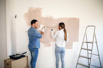 Couple renovating apartment.