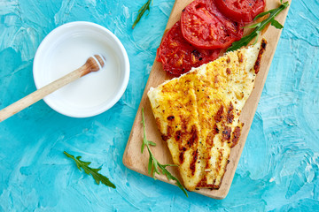 Wall Mural - Grilled pike fillet with tomatoes on wooden board