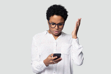 confused biracial woman have malfunction problem using cellphone