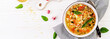 Minestrone, italian vegetable soup with pasta on white table. Vegan soup. Banner. Top view
