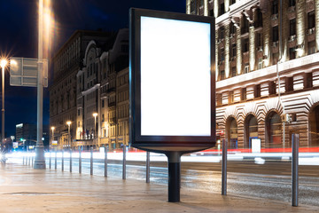 Wall Mural - Blank white outdoor banner stand at night time in the city