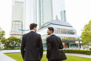 Wall Mural - Two attractive young businessmen wearing suits