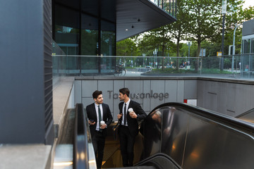 Wall Mural - Two attractive young businessmen wearing suits