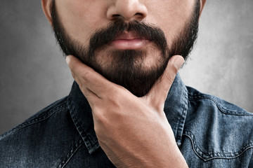 Wall Mural - Bearded man touching his beard