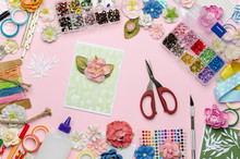 Paper Flowers, Scissors, Homemade Card, Paper And Scrapbooking Items On Pink Background. Scrapbooking, Top View