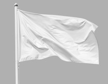 White Flag Waving In The Wind On Flagpole, Isolated On Gray Background, Closeup