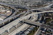 Aerial view of the Harbor 110 and 105 freeway interchange roads and bridges south of downtown Los Angeles in Southern California.
