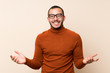 © luismolinero - Colombian man with turtleneck sweater with glasses and smiling