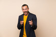 © luismolinero - Colombian man over isolated background points finger at you