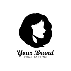 Wall Mural - logo template of silhouette woman with curly hair in black and white