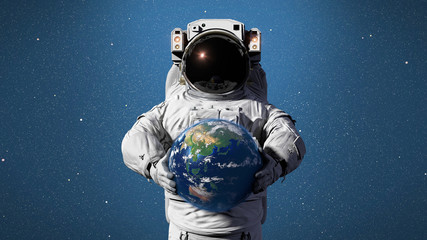 Wall Mural - astronaut holding planet earth featuring asia, oceania and australia