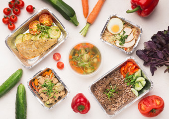 Wall Mural - Foil containers with healthy food on white background