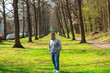 © Alejandro - Man  Poses in the park in front of leading lines of tress