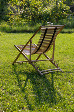 Lounge Chair Made Of Bamboo On A Green Lawn