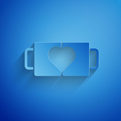 Paper cut Two coffee cup and heart icon isolated on blue background. Couple coffee for lovers on Valentines Day. Paper art style. Vector Illustration