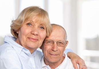 Wall Mural - An elderly happy couple in the background of their home