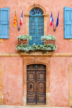 Colorful Ochre Colored Fa?ade Of Mairie (mayor's Office) In Roussillon, Vaucluse, Provence-Alpes-C?te D'Azur, France