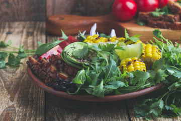 Wall Mural - Salad bowl with abocado and colorful vegetables, healthy vegan plant based meal