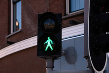 Pedestrian Green Traffic Light On Building Facade Background