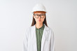 © Krakenimages.com - Young chinese engineer woman wearing coat helmet glasses over isolated white background puffing cheeks with funny face. Mouth inflated with air, crazy expression.