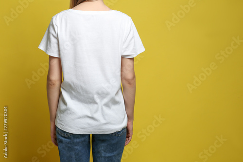 Download Back View Of Young Woman Wearing Blank T Shirt On Yellow Background Closeup Mockup For Design Buy This Stock Photo And Explore Similar Images At Adobe Stock Adobe Stock PSD Mockup Templates