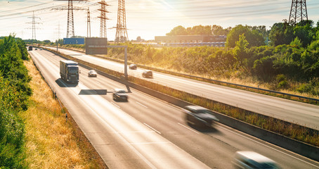 Wall Mural - Lots of Trucks and cars on a Highway - transportation concept